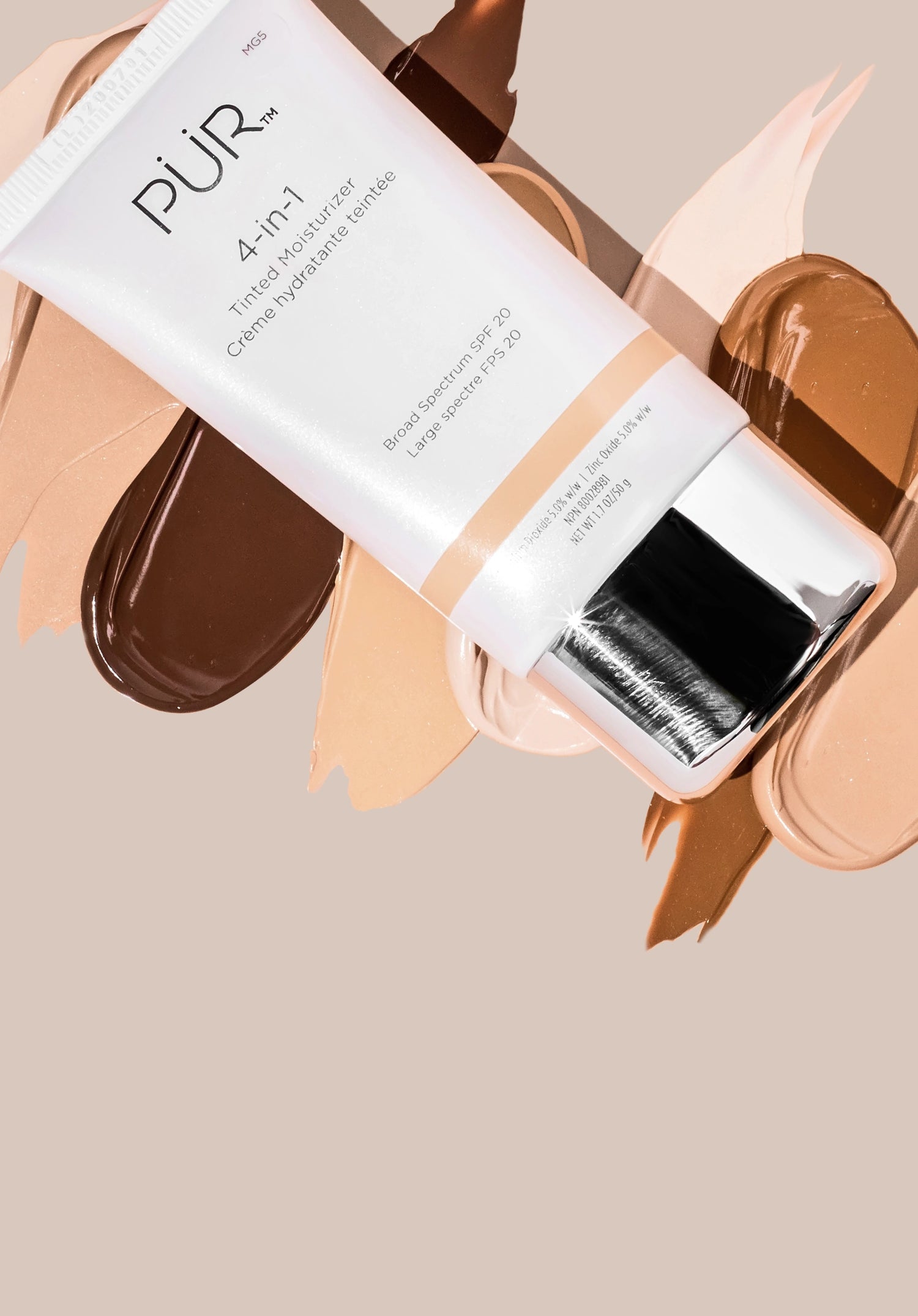 Tinted Moisturizer - Back in Stock: Bottle of Tinted Moisturizer laying against various shade swatches on neutral background (mobile)