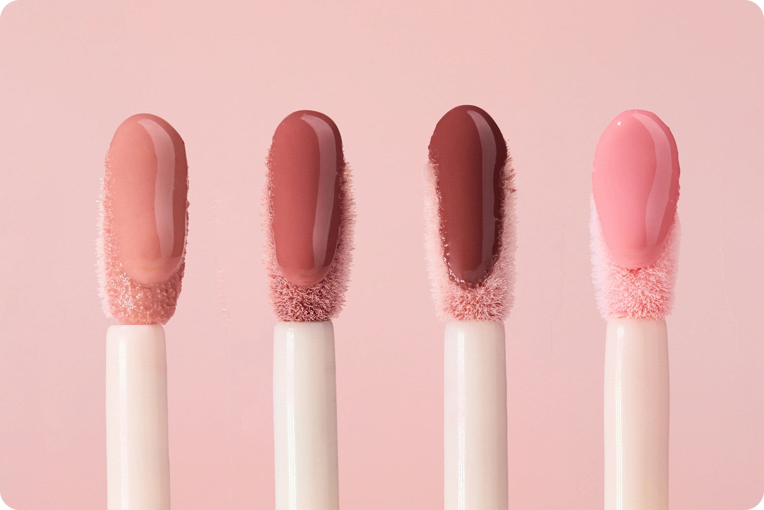 Close up of lip brush with product from Glossy Lip Tint