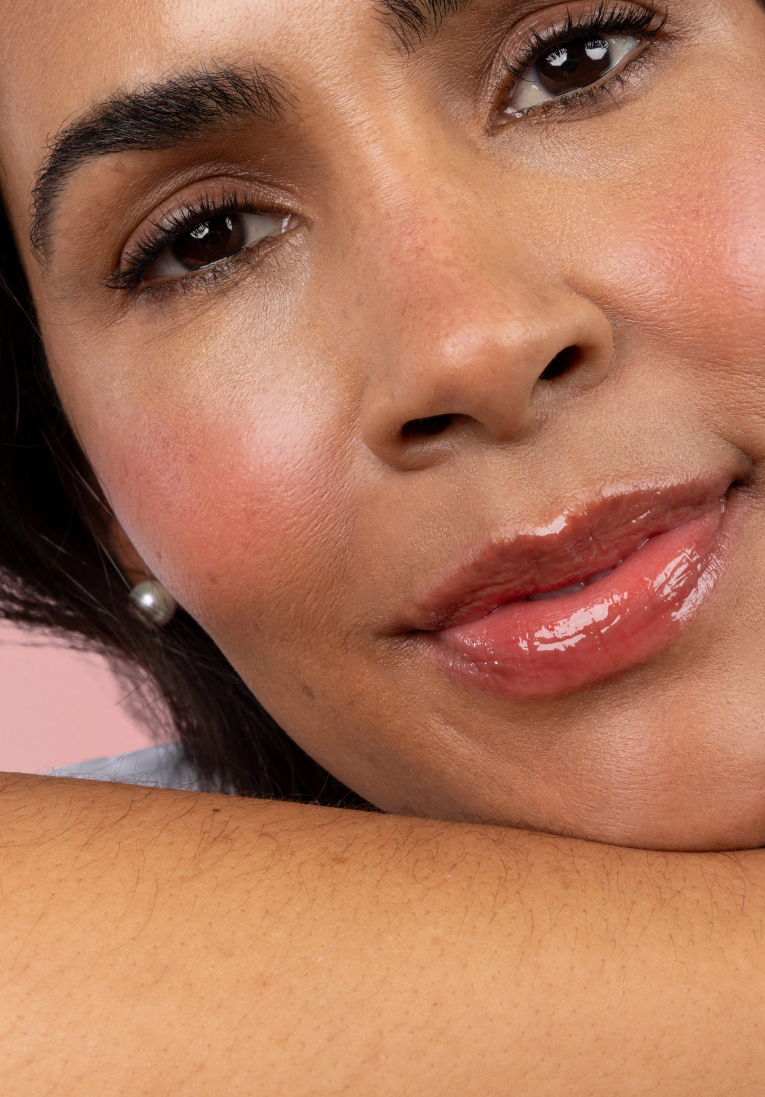 Cherry Blossom Flush - 25% Off Lip and Cheek - woman leaning on arm against pink background